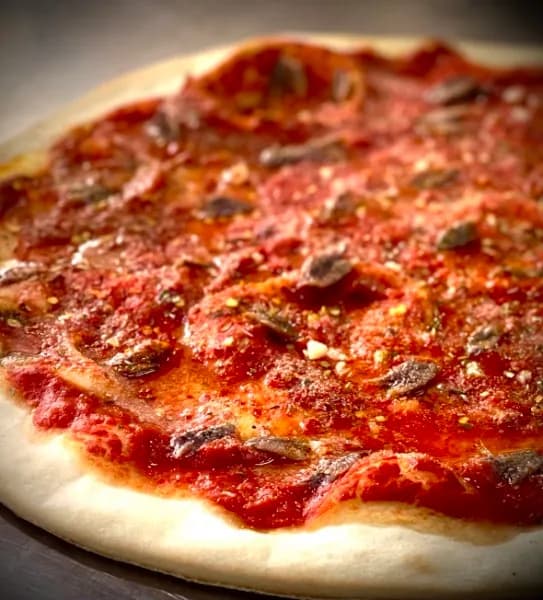 The Marinara, marinated tomato sauce, anchovies, garlic and spices, no cheese