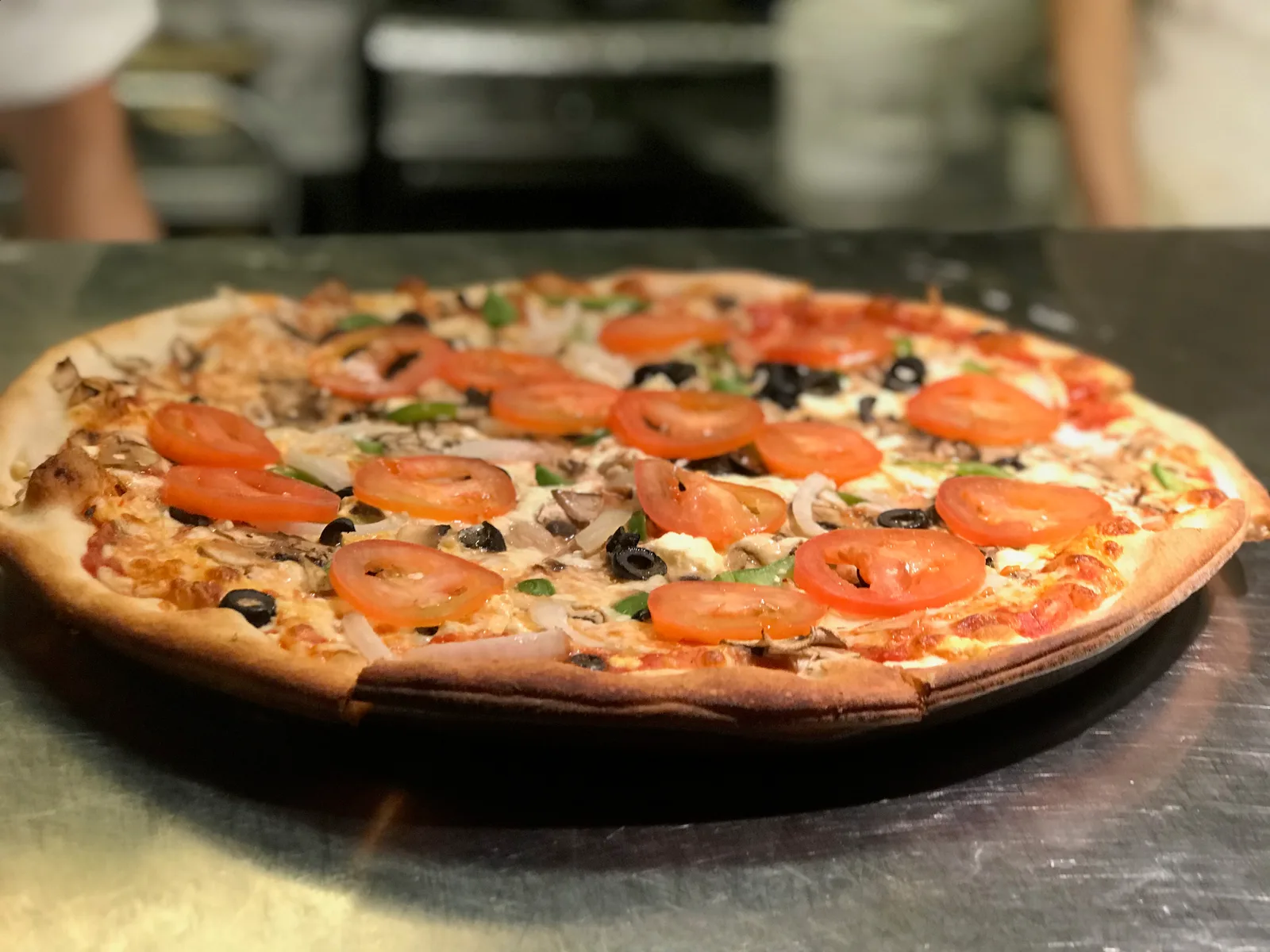 The Vegetarian, peppers, onions, tomato, olives, mushrooms and feta